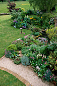 LAUNA SLATTER'S Garden, OXON: THE POND AND LAWN From THE HOUSE with BIRD TABLE AND GRAVEL PATH