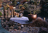 WOODEN LANDING STAGE with Container IN Frost Beside THE POOL. JOHN MASSEYS Garden, WORCESTERSHIRE