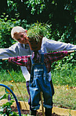 Designer Clare MATTHEWS: SCARECROW PROJECT: Boy with SCARECROW IN POTAGER