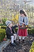 Children looking for Easter eggs in the farm garden