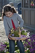 Girl with a sparrow basket as an Easter nest