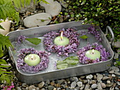 Small Syringa (lilac) wreaths with floating candles
