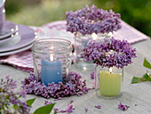 Lantern from screw cap jars with candles and Syringa wreaths