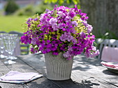 Bouquet of geranium (cranesbill), dianthus (carnations) and alchemilla