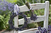 Wreath and bouquet of lavender (Lavandula) hung on the back of a chair