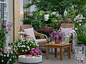Pink and white evening terrace with candlelight