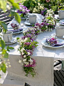 Late summer table decoration with blossom garland