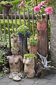 Artist's garden: Pottery art objects on the fence