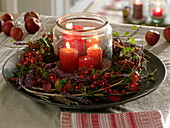 Winding autumn wreath of clematis vines (woodland vine), rose (rose hips)