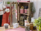 Small cupboard with dried herbs and incense bundles
