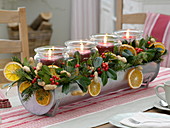 Unusual Advent wreath with preserving jars in a tin channel