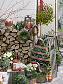 Rustic Christmas terrace with firewood pile