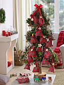 Stylised Christmas tree made of birch brushwood as Advent calendar