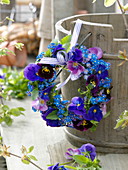 Small wreath of viola cornuta (horned violet) and myosotis