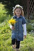 Girl with bouquet of buttercups