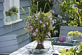 Bunch of stems with willow branches, mallows and lady's mantle