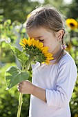 Girl with Helianthus annuus (Sunflowers)