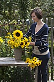 Young woman sticks bouquet