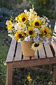 Yellow-white bouquet of Helianthus (sunflowers), Gladiolus (gladioli)