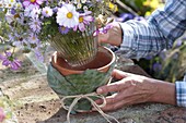 Cabbage leaves as decorative covering for clay pot (3/4)