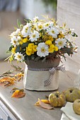 White-yellow autumn bouquet with Anemone japonica (autumn anemone)