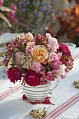 Autumn bouquet of pink (roses and rose hips), hydrangea