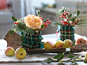 Rosa (rose), Ilex (red winter berries), Viscum album (mistletoe) and Abies