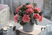 Winter bouquet made of Dianthus (carnation), Abies twigs