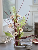 Modern standing bouquet of Gerbera Germini 'Cream Café' with branches
