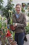 Woman buying flowers at garden centre