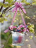 Lantern with wreath of primula, muscari