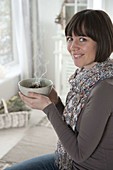 Woman smoking herbs in herb bowl