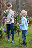 Children with tied palm bouquets made from branches of Salix (catkin willow)