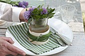 Herb bouquet in cheese box as napkin decoration