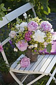 Early summer bouquet from Paeonia, Alchemilla