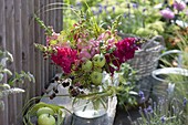 Pink bouquet with Antirrhinum (snapdragon), blackberries