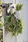 Herbal bouquet on the door handle