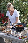 Outdoor kitchen Asian cooking with wok