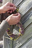 Small heather wreath with Chinese reed as door wreath