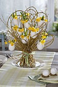 Standing bouquet of willow with eggshells as vases