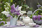 Fragrance syringa bouquet in zinc can, tea with lilac flowers