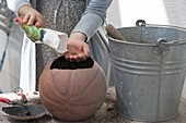 Repurpose an old ball as a planter