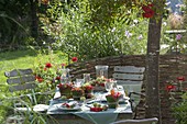 Late summer table decoration with rowan berries