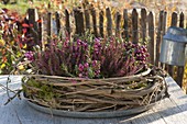 Wreath of clematis tendrils on zinc bowl, filled