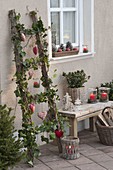 Christmas decorated wooden ladder with hedera, Led fairy lights