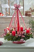 Hanging Christmas wreath on wooden stand