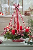 Hanging Christmas wreath on wooden stand