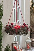 Advent wreath with dry branches, rose hips and apples