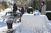 Snow bar in the winter snowy garden