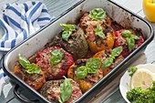 Stuffed peppers from the oven, decorated with basil